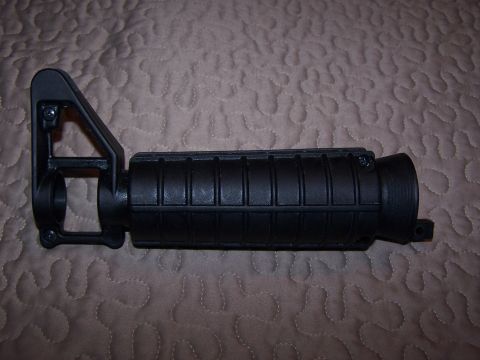 1986 Ford Bronco - Close-up of a black AR-15 rifle front sight and handguard assembly.