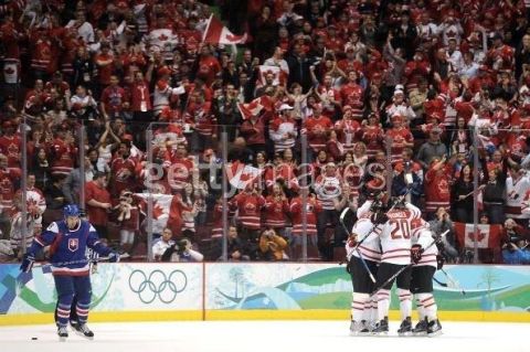 1996 Ford Bronco - A hockey game is underway with players on the ice and a cheering crowd in the stands.