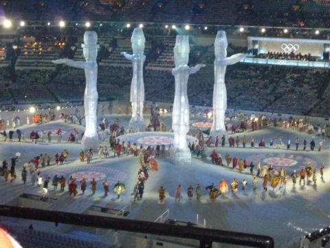 1996 Ford Bronco - Performers in costumes are on the field during an Olympic opening ceremony, with large ice-like sculptures in the background.
