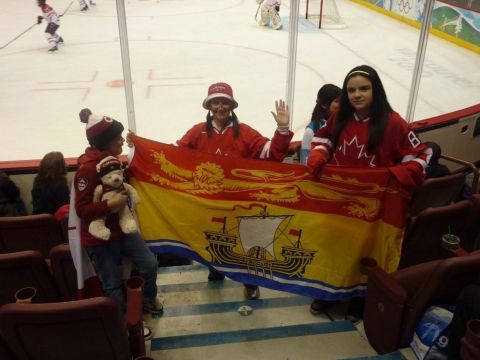1996 Ford Bronco - Fans display a provincial flag while watching an ice hockey match.