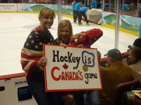 1996 Ford Bronco - Fans cheer at the Vancouver 2010 Olympics, holding a sign that reads 'Hockey is Canada's game'.