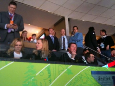 1996 Ford Bronco - Spectators are seated in a stadium, some dressed in formal attire.