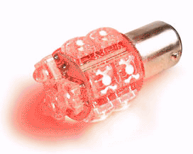 1995 Ford Bronco - A close-up view of a red LED light bulb, highlighting its internal structure and emitting a soft red glow.