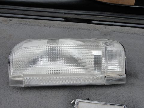 1995 Ford Bronco - A single clear plastic headlight assembly is shown, likely a replacement part.