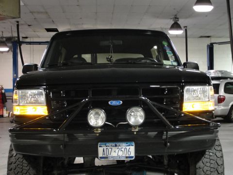 1995 Ford Bronco - 1995 Ford Bronco front view, showing custom bumper and lights.