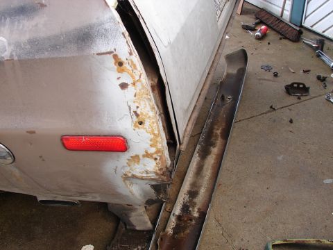 1973 Ford Ranchero - Rust damage and a detached bumper are visible on the rear quarter panel of this 1973 Ford Ranchero.