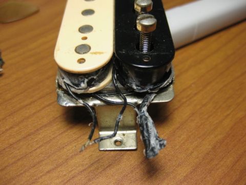 1989 Mazda MX-6 - This image shows a guitar pickup, not a 1989 Mazda MX-6, with visible wiring and mounting hardware.