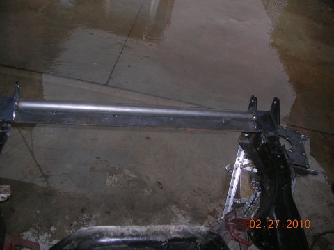 1985 Ford Bronco - Metal tube assembly on jack stands, likely part of a vehicle repair or fabrication project.
