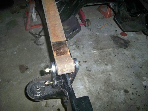 1985 Ford Bronco - Vehicle suspension part, likely a leaf spring, shown during a repair or modification.
