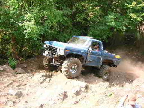 1979 Ford Bronco - This modified 1979 Ford F-Series truck navigates a challenging off-road trail.