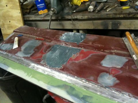 1993 Ford Bronco - Bodywork in progress on a car door, showing filler and primer application.
