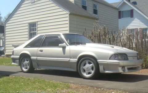 1987 Ford Mustang - This 1987 Ford Mustang GT coupe is parked outside a residential home.