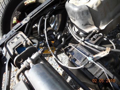 2007 Ford Mustang - Close-up view of a vehicle's undercarriage, showing mechanical parts and a timestamp.