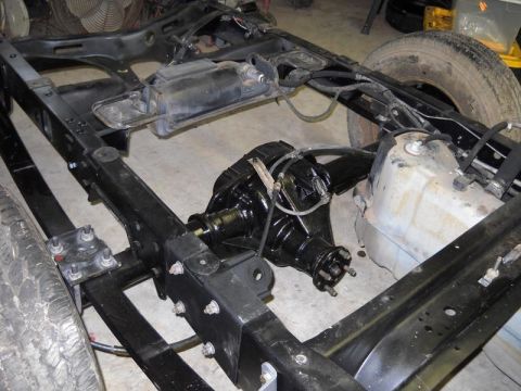 2007 Ford Mustang - Close-up view of a vehicle's rear axle and chassis components.