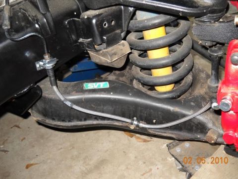 2007 Ford Mustang - A close-up view of a vehicle's suspension system, highlighting an SVT badge.