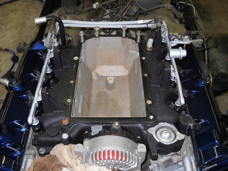 Engine intake manifold and alternator assembly