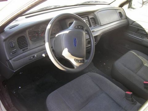 1991 Ford Crown Victoria - Interior view of a Ford vehicle, showing the dashboard, steering wheel, and front seats.