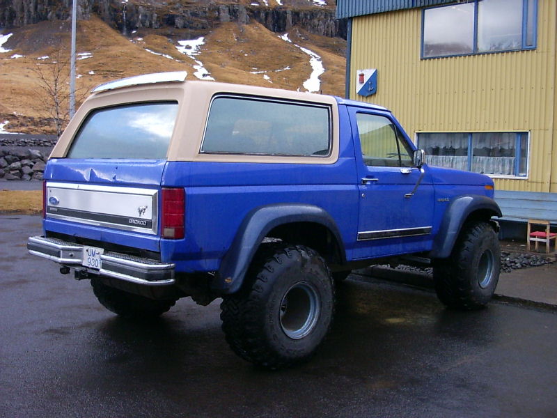 1986 Ford Bronco, blue with tan removable top, lifted suspension, off-road tires