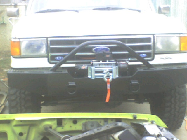 White 1989 Ford Bronco front view with winch