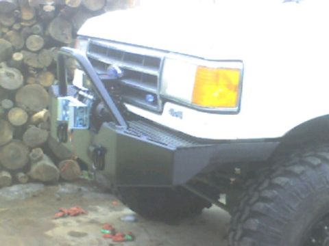 1989 Ford Bronco - Front view of a 1989 Ford Bronco, an aftermarket bumper and grille.