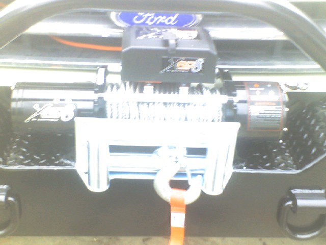 Front view of a Ford Bronco with a winch mounted on the bumper
