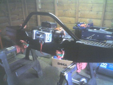 1989 Ford Bronco - Aftermarket bumper and winch assembly is shown in a workshop setting.