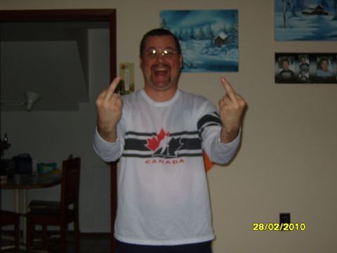 1989 Ford Bronco - Man in a white shirt with a Canadian maple leaf design gives the middle finger.