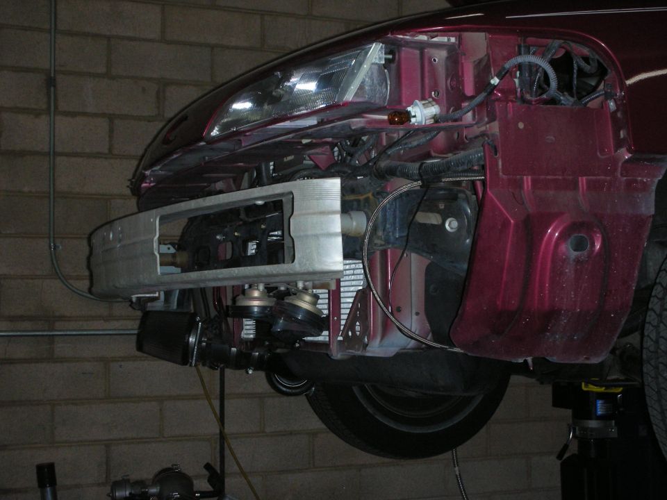 1992 Ford Crown Victoria front end with intercooler, maroon paint, disassembled bumper, visible headlights and horns