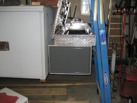 1996 Ford Bronco - A diamond plate toolbox sits open beside a Werner ladder in a cluttered garage setting.