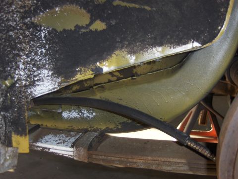 1971 Chevrolet Camaro - Close-up of the underbody structure and suspension parts of a vehicle.