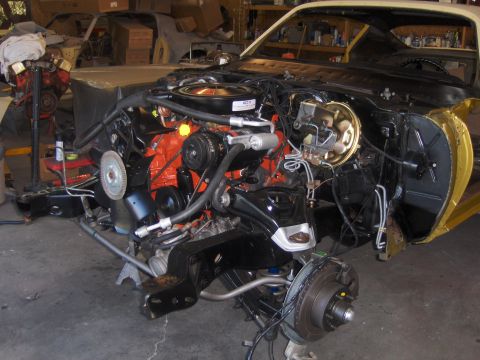 1971 Chevrolet Camaro - Front end of a 1971 Chevrolet Camaro disassembled for restoration, showing engine bay and suspension components.