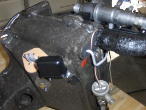1970 Chevrolet Camaro - Close-up of an automotive part with visible wiring and a metallic fitting, likely from an engine bay.
