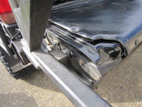 1996 Ford Bronco - Custom rear bumper and tailgate latch detail on a vehicle.