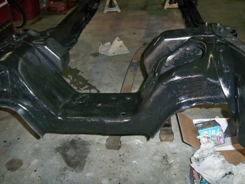 1985 Ford Bronco - Vehicle frame and suspension components are shown after being painted black.