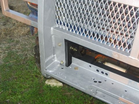 1984 Ford Bronco - Close-up view of a custom brush guard mounted on a vehicle, showing its construction details.