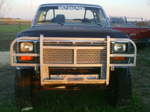 1984 Ford Bronco - This Ford Bronco features a custom brush guard and a Skyjacker decal on the windshield.