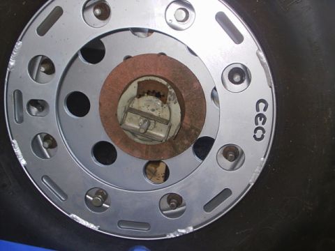 1984 Ford Bronco - Close-up view of a silver wheel, identified with the marking 'CEQ'.