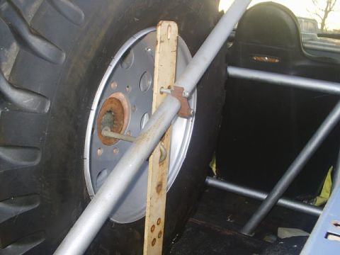 1984 Ford Bronco - Interior view showing a large spare tire and roll cage structure.