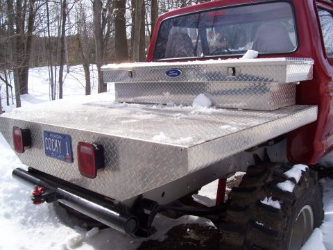 1978 Ford F-150 - Rear view of a 1978 Ford F-150 pickup truck with a custom diamond plate flatbed and toolbox in the snow.