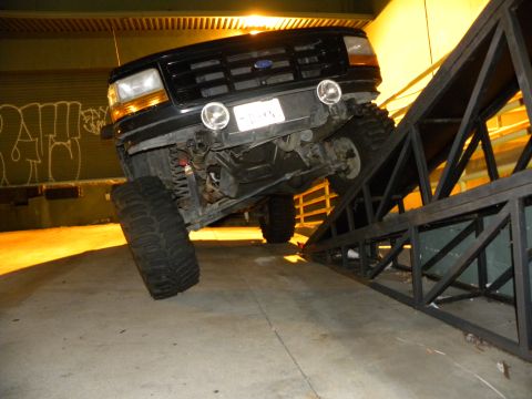 1995 Ford Bronco - This 1995 Ford Bronco is positioned on a metal ramp, its large tires and suspension.