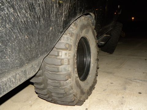 1995 Ford Bronco - Close-up of a large off-road tire and fender flare on a vehicle.