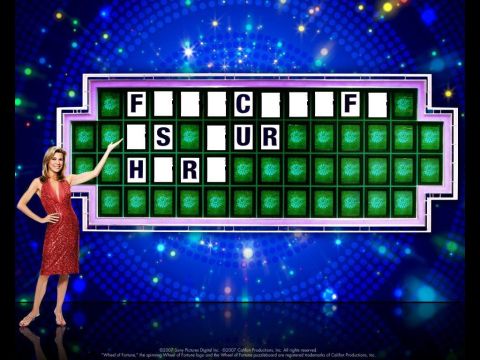 1971 Ford Ranchero - A game show host gestures towards a puzzle board on the Wheel of Fortune.