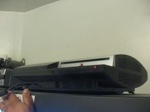 1968 Ford Mustang - A PlayStation 3 console is visible with its red power indicator illuminated.