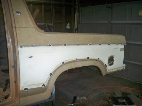1985 Ford Bronco - This 1985 Ford Bronco is undergoing body panel repair, evident by the visible welding spots along the rear quarter panel.