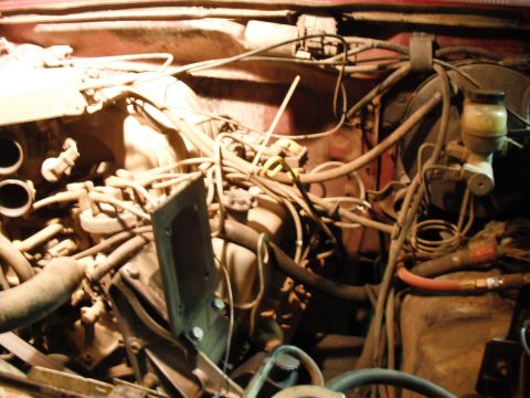 1991 Ford Bronco - Close-up view of an engine bay, focusing on the brake fluid reservoir and associated plumbing.