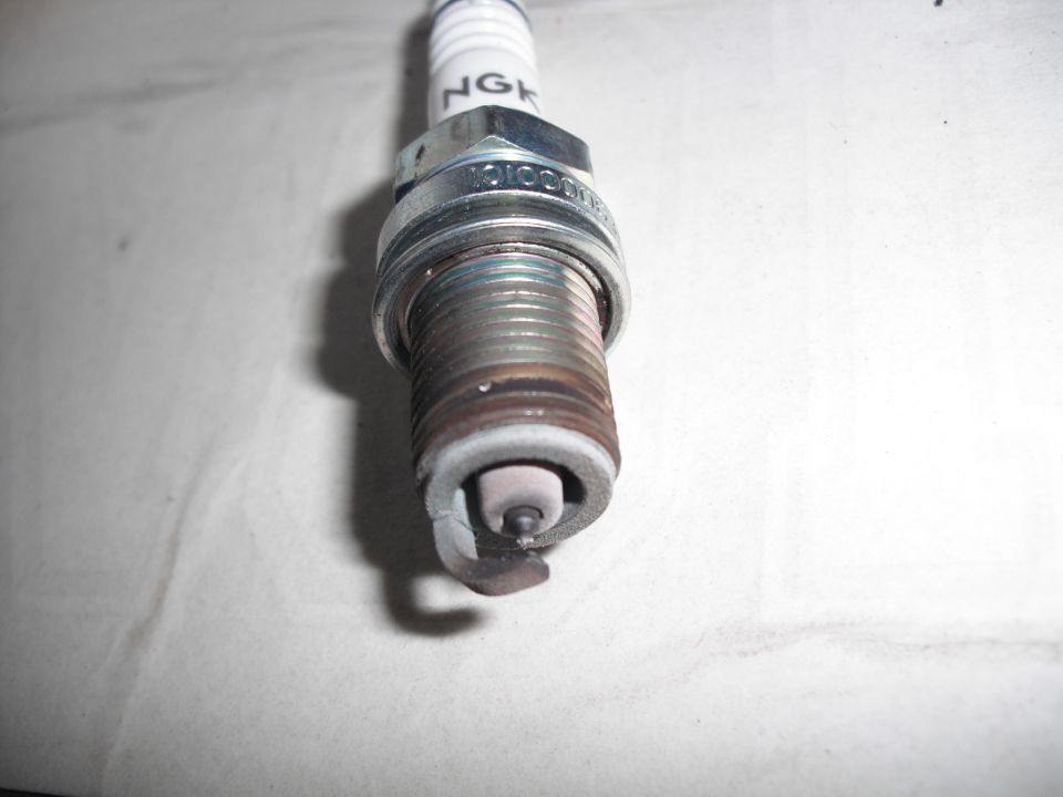 NGK spark plug with worn electrode