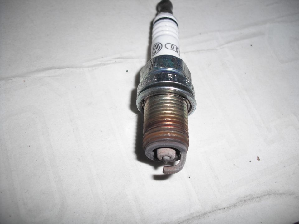 Spark plug with Audi and Volkswagen logos