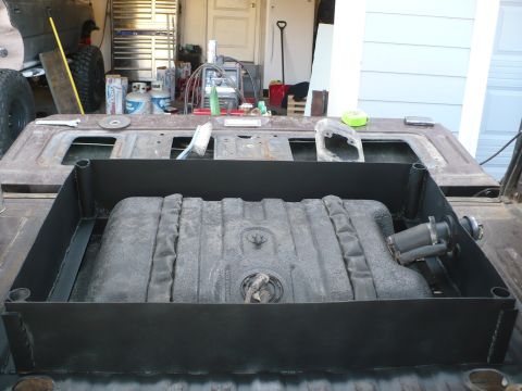 1979 Ford Bronco - Aftermarket fuel tank installation in a truck bed, showing the tank and mounting bracket.
