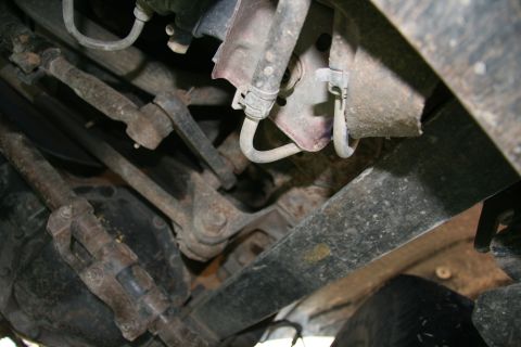 1993 Ford Bronco - Underside view of vehicle steering and suspension components.