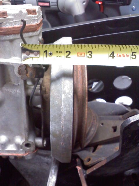 1977 Ford F-100 - A yellow measuring tape is shown on a metal engine part, with markings up to 5 inches visible.
